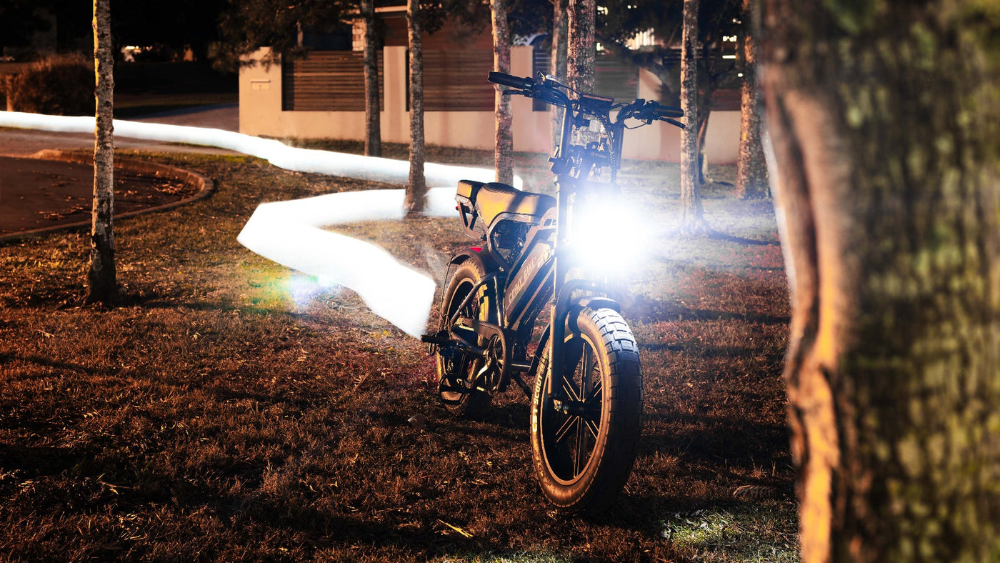 Bicycle with a light on a path at night