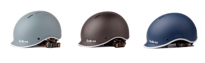 Five helmets in different colors on a white background