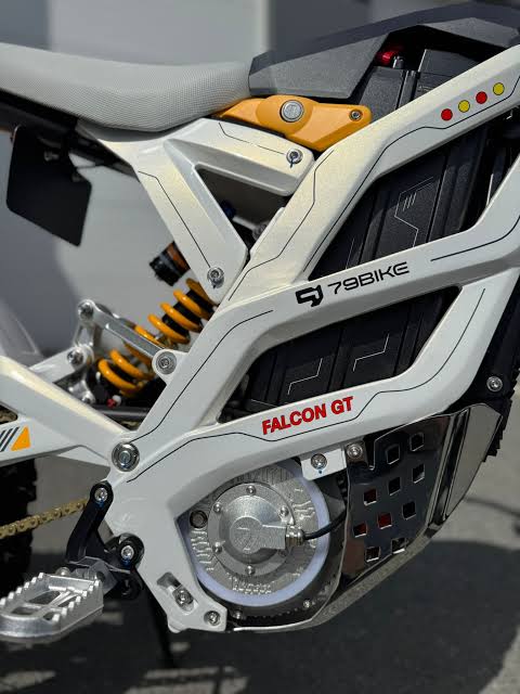 Close-up of a motorcycle engine with '79Bike' branding on a blurred background